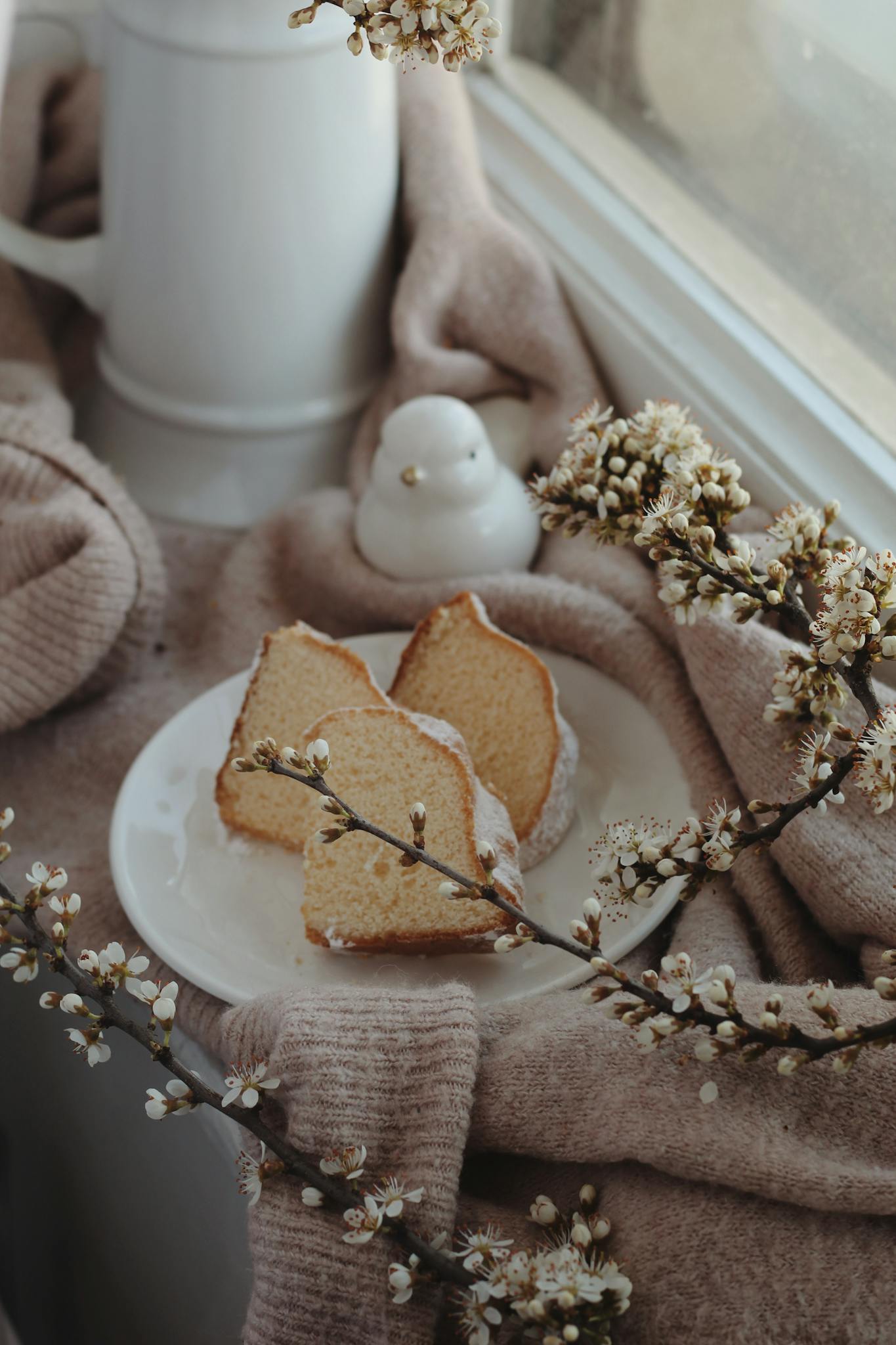 Bundt cake on windowsill near decorations